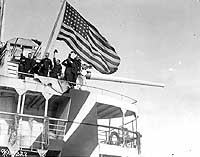 Photo # NH 43081: Crew members wave from USS Orizaba as she sails from New York for France, 1918