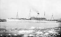 Photo # NH 106032:  S.S. Minnesota in Boston Harbor, early in 1918, while painted in Mackay low visibility camouflage.  She was later USS Troy